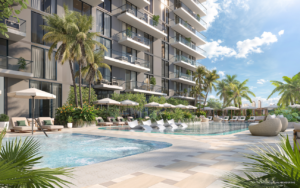 Resort-style pool deck with sun loungers and private cabanas at Viceroy Residences Aventura, a Miami luxury home development.